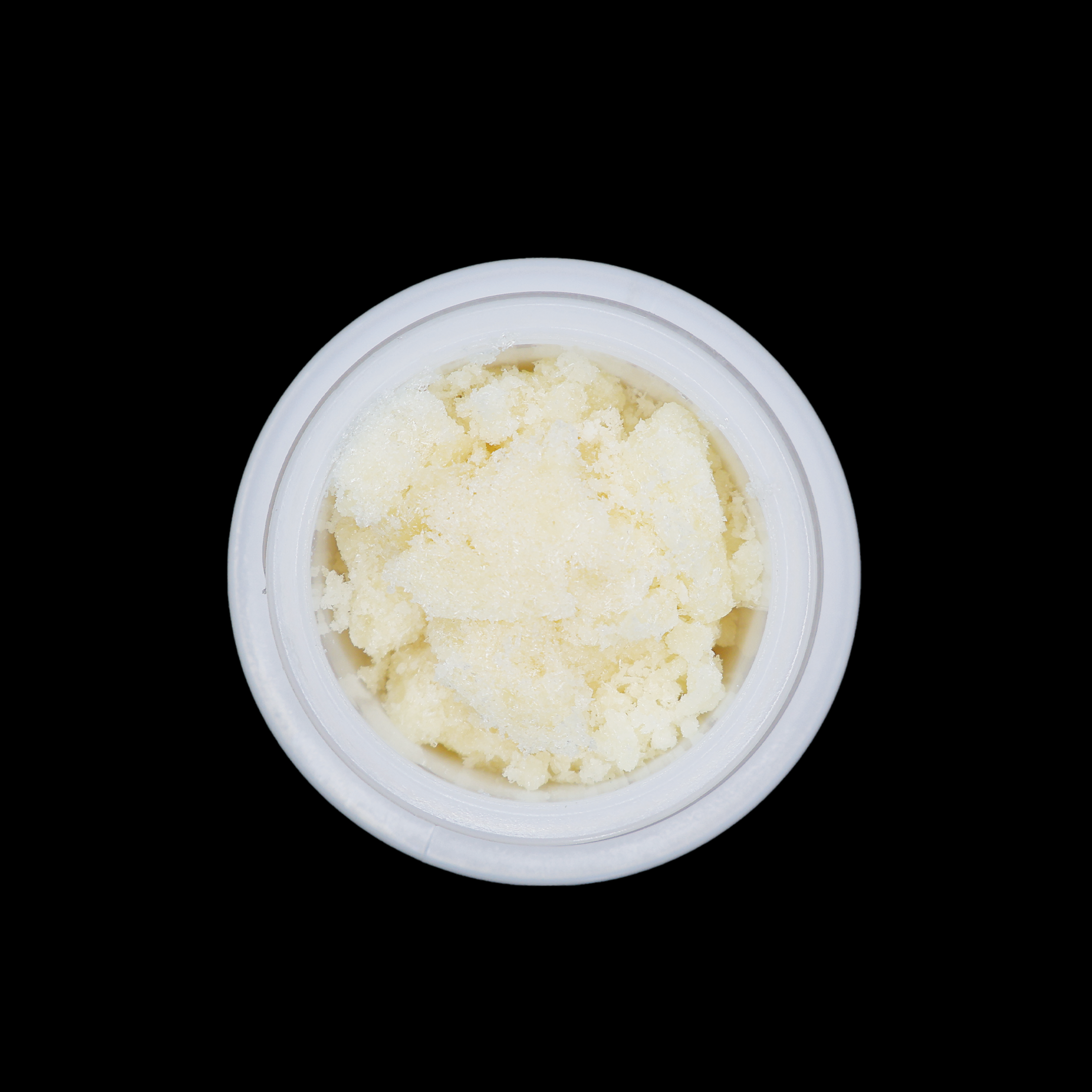 Girl Scout Cookies THCa Crumble from Miracle of The Desert, close-up of golden, textured cannabis concentrate in a jar.