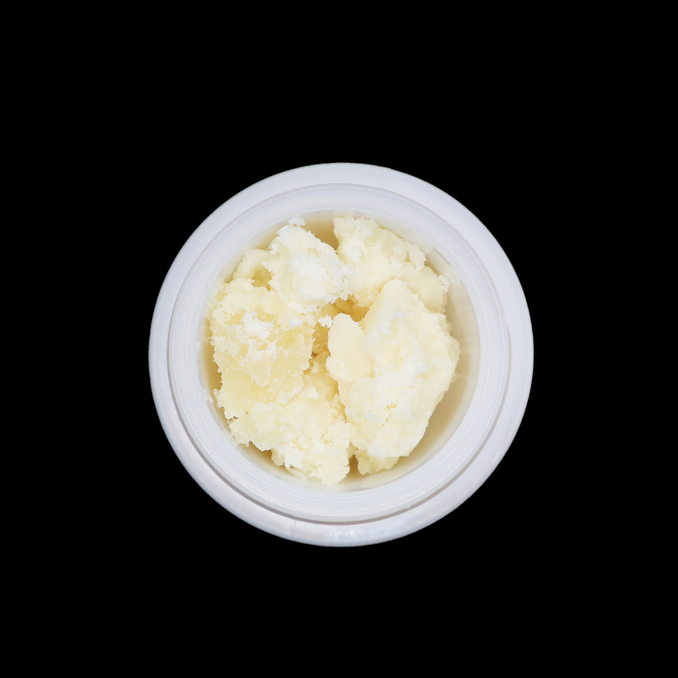 Crumbly OG Kush THCa crumble by Miracle of The Desert with golden-colored cannabis concentrate in a clear container.