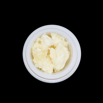 Crumbly OG Kush THCa crumble by Miracle of The Desert with golden-colored cannabis concentrate in a clear container.