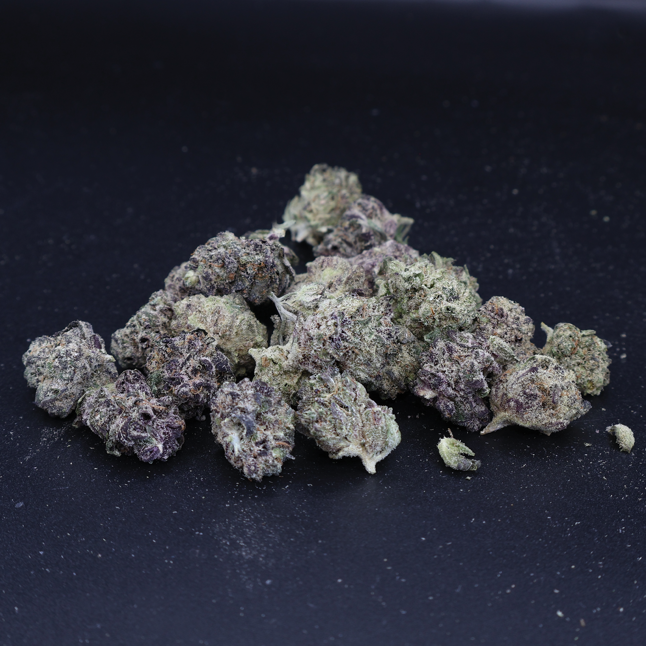 Miracle of the Desert Blizzard Bush THCA Flower small buds with frosty trichomes and vibrant green coloration.