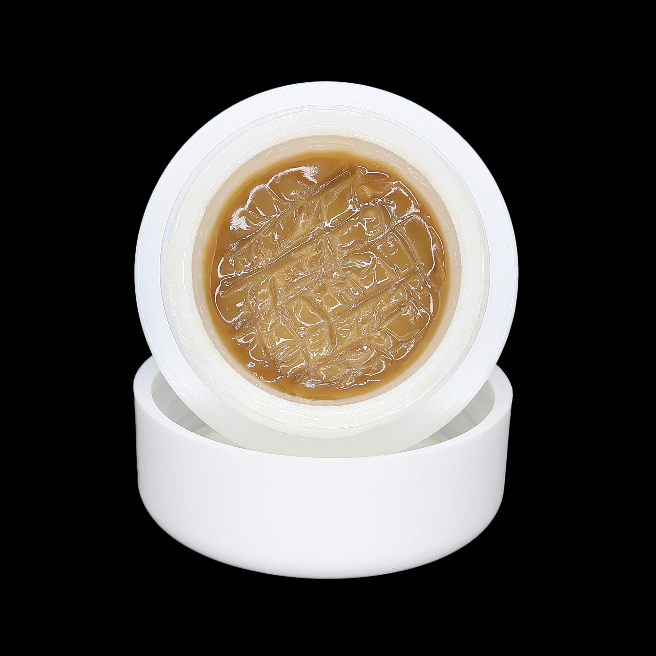 Close-up of Sour Chem X OG 95 Hash Rosin from Miracle of The Desert, showcasing its golden, sticky hash rosin texture.